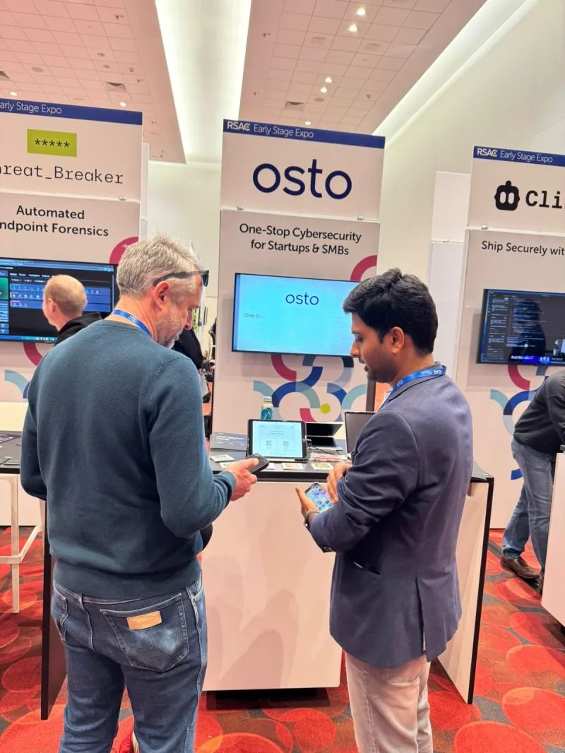 The Osto booth at the RSAC 2026 Early Stage Expo, with a visitor trying the product